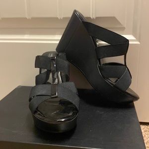Black wedge’s with straps across top of foot